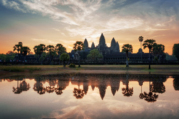 Fototapeta na wymiar Angkor Wat reflected in lake at dawn. Siem Reap, Cambodia