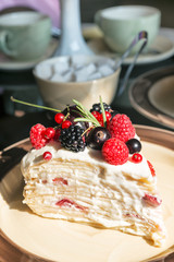 Delicious cake with berries on plate on table close up. cheese cake with raspberry, rosemary and mascarpone