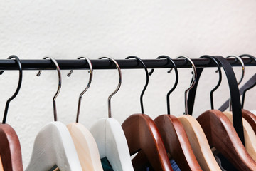 Clothes hang on a shelf 