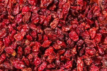 Dried red Tibetan spicy barberries placer background