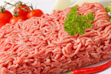 Raw ground pork and vegetables