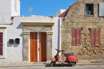 Selbstklebende Fototapeten Old Scooter in Greece © Ruslan Kurbanov