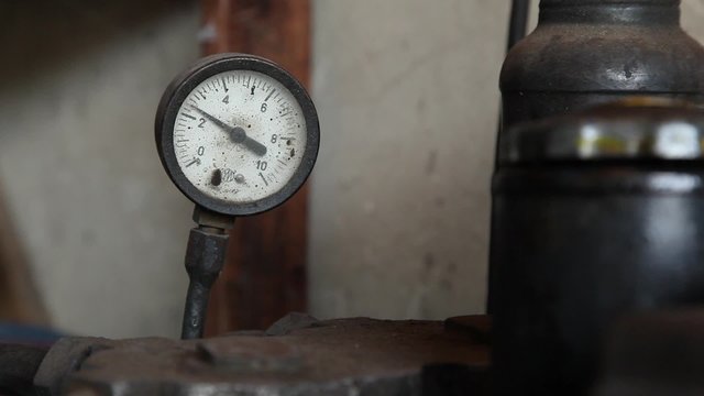 Close up pressure gauge with compressor working
