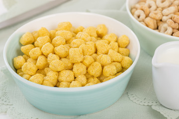 Golden Nuggets - Whole grain cereals in a green bowl.