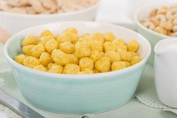 Golden Nuggets - Whole grain cereals in a green bowl.