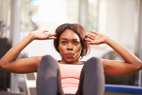 Young Woman Doing Crunches In A Gym, Close Up