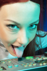 DJ teasing with music - Female DJ playing music - pushing the slider with tongue!