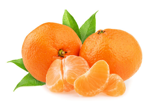 Tangerines with leaves and slices on white background