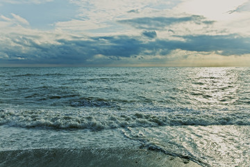 Naklejka na ściany i meble Ocean waves on a sandy beach