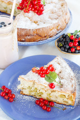 piece of sweet cake with red currants