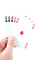 man's hand holding playing cards isolated