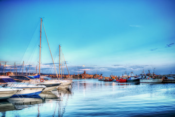 boats in Alghero harbor in hdr