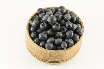 Blueberries in a wooden round shape