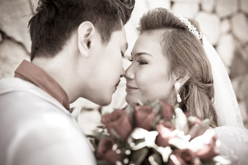 Fototapeta premium Wedding shot of bride and groom in park