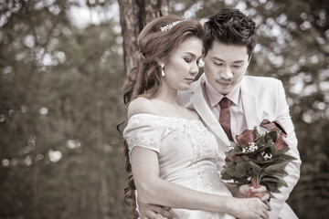 Wedding shot of bride and groom in park