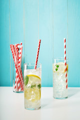 Lemonades with assorted big red paper straws