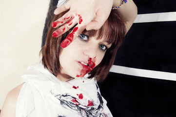young woman with bloody face