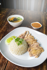 hainanese boiled chicken rice on the wooden table