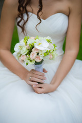 Obraz na płótnie Canvas Bride holding big wedding bouquet before ceremony