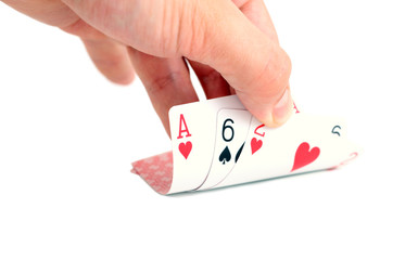 Hand and playing cards isolated on white