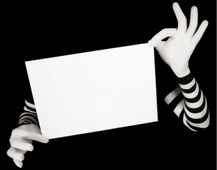hands in striped gloves hold a white blank