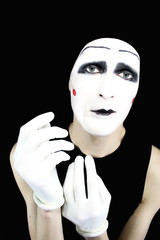 Portrait of the mime in white gloves