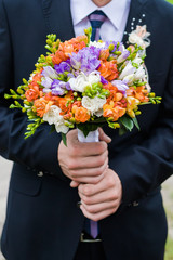 Big wedding bouquet before wedding ceremony. Bride or groom.