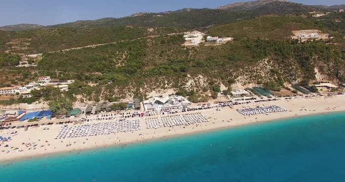 Aerial view of people enjoying on the Greek Lefkada sandy beach
