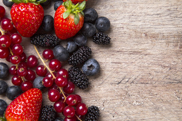 Some gooseberries, raspberries, strawberries and blueberries ove