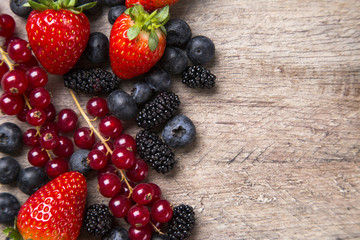 Some gooseberries, raspberries, strawberries and blueberries ove