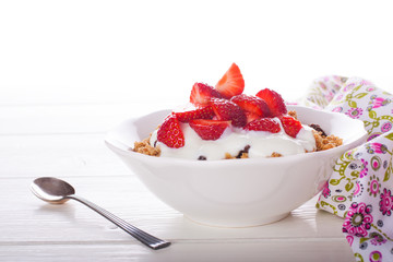Yogurt with granola and fresh strawberries