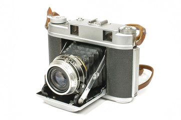 Old bellows medium format camera isolated on the white background