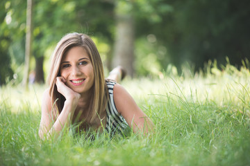 Cute woman relaxing in garden