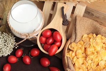 corn flake and milk with fresh cherry tomatoes.