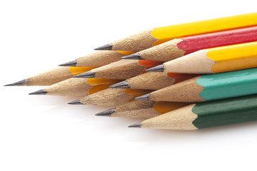 Stack of multicolored pencils close up isolated on white background 