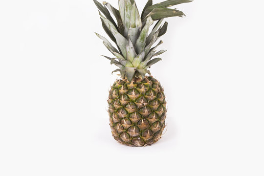 Pineapple fruit isolated on white in studio (food background, wallpaper)