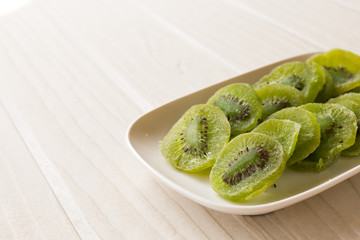 slices of dried kiwi on the sacking background