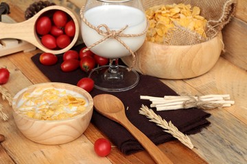 corn flake and milk with fresh cherry tomatoes.