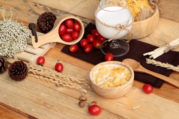 Fototapeta na wymiar corn flake and milk with fresh cherry tomatoes.