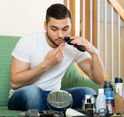 Shaving moustache by electric razor