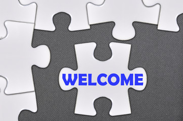 Fototapeta premium jigsaw puzzle written word welcome