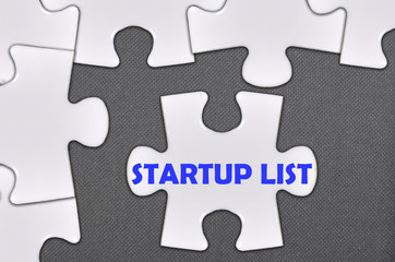 Fototapeta premium jigsaw puzzle written word startup list