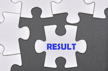 Fototapeta premium jigsaw puzzle written word result