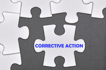 Fototapeta premium jigsaw puzzle written word corrective action
