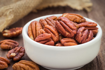 Pecan nuts in white bowl