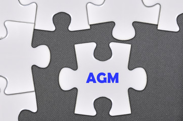 Obraz premium jigsaw puzzle written word agm