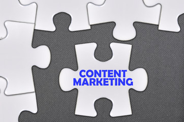 Fototapeta premium jigsaw puzzle written word content marketing
