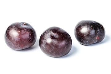 fresh plum on white, tilt shift lens