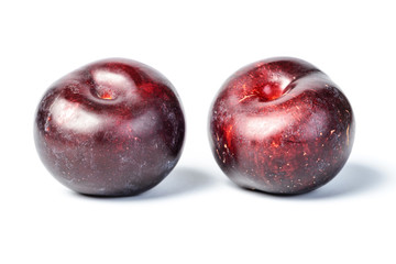 fresh plum on white, tilt shift lens