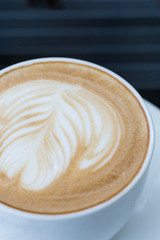 hot coffee latte, latte art with heart in a white cup